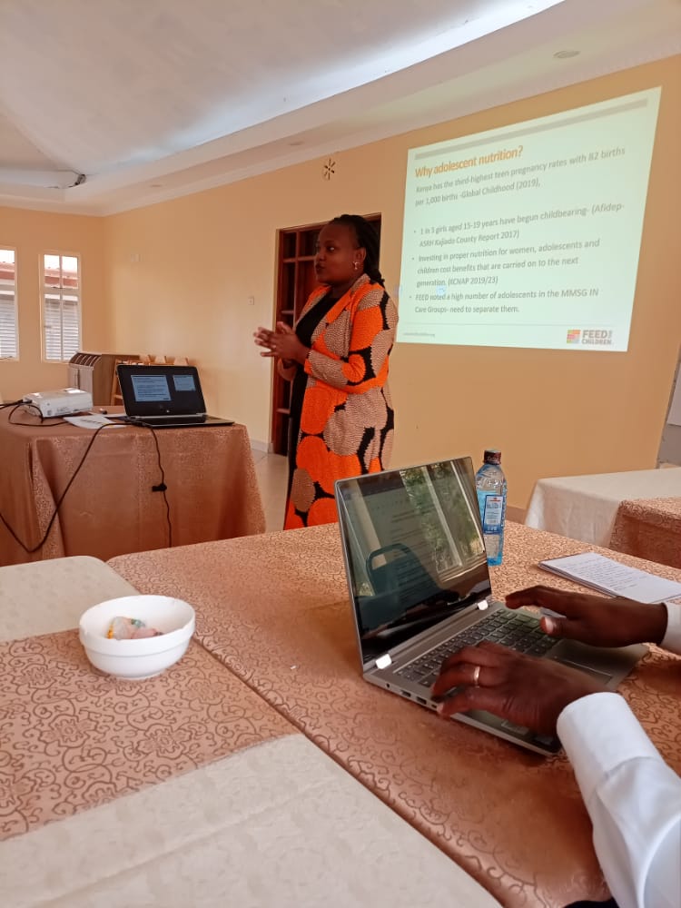 Woman standing up doing a presentation