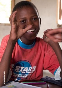 A child using sign language in school
